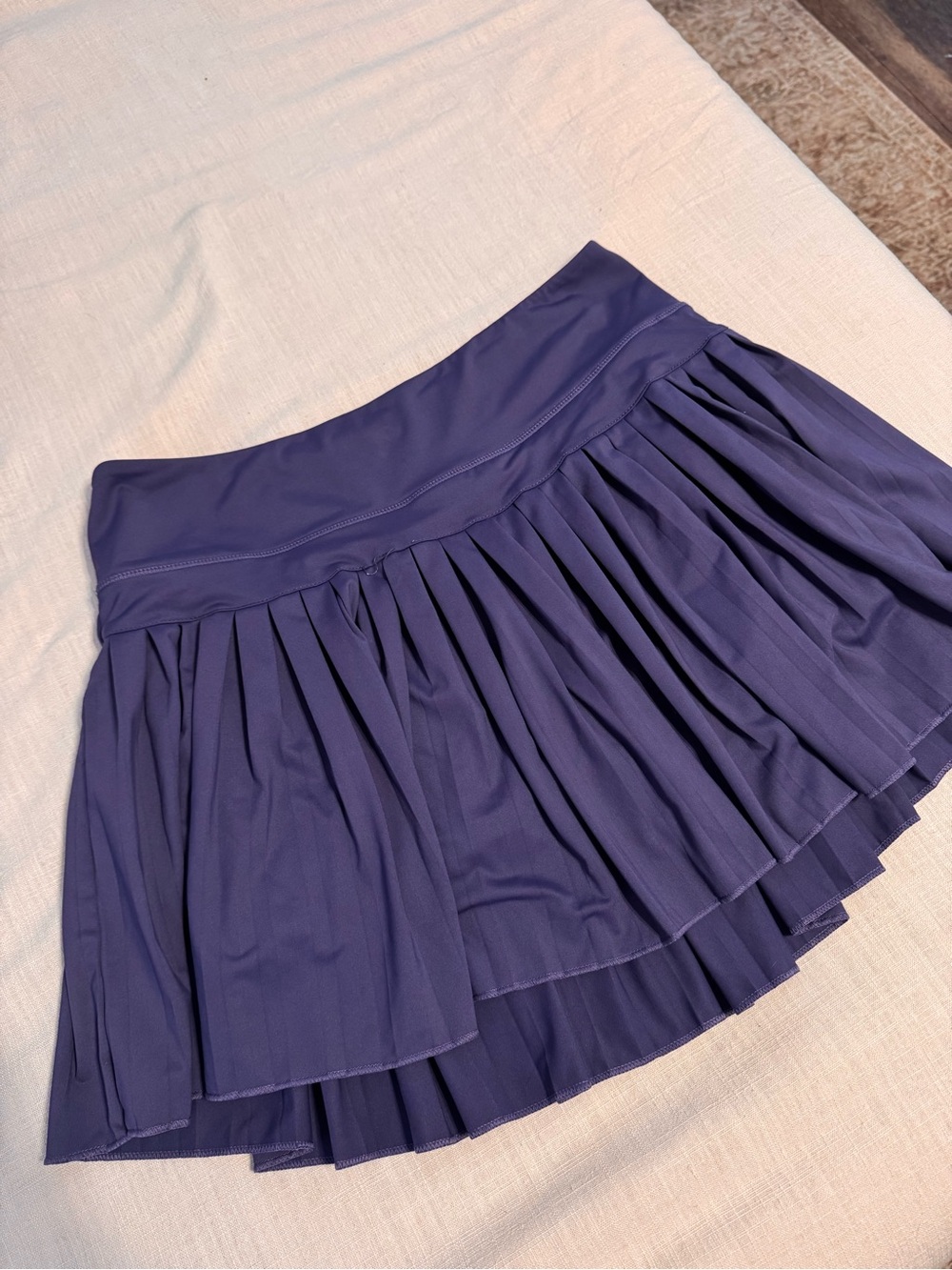 Pleated gold hinge skirt in navy